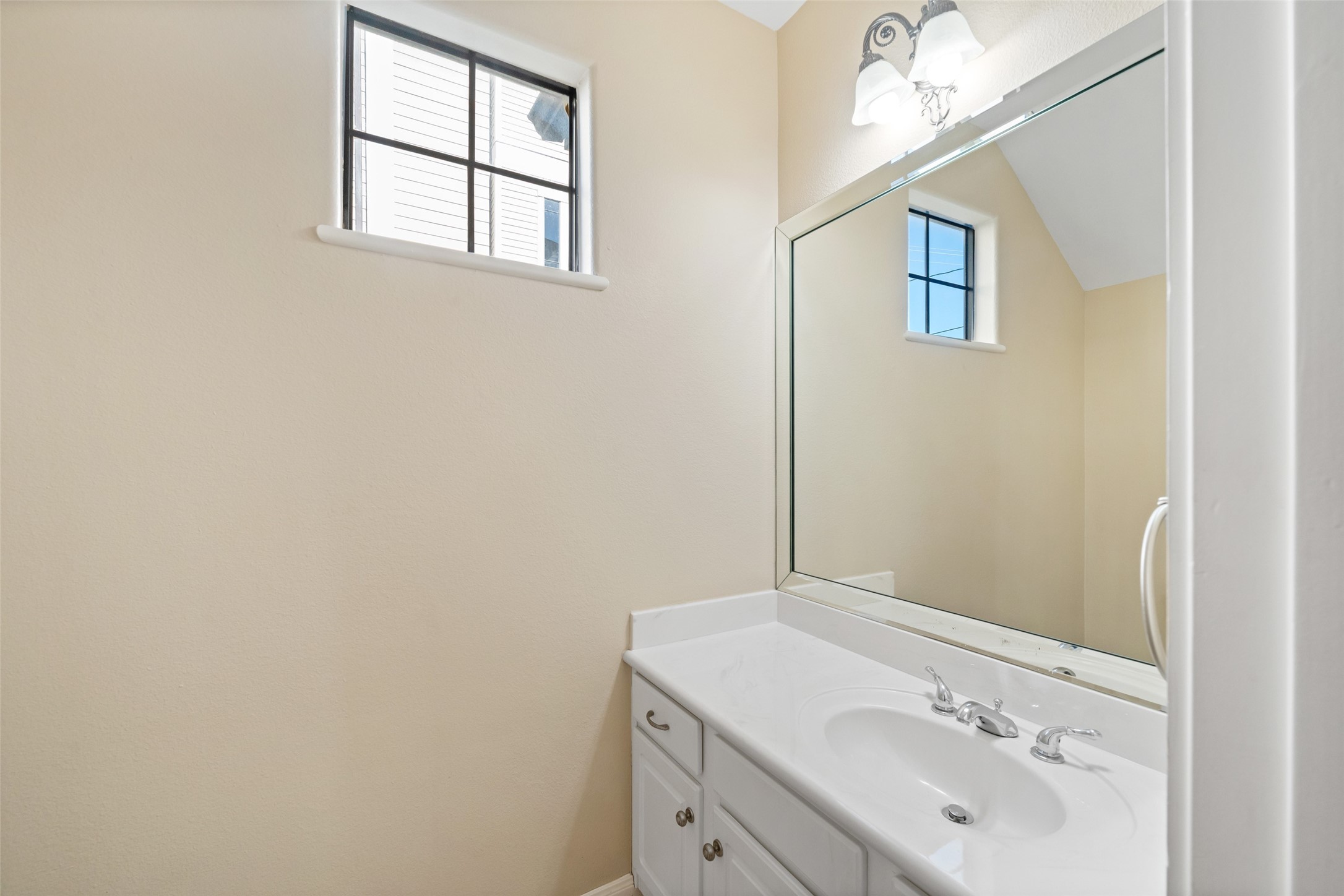 2406 Calumet Street Houston, TX 77004 - Photo 25 of 37 a bathroom with a sink and a mirror