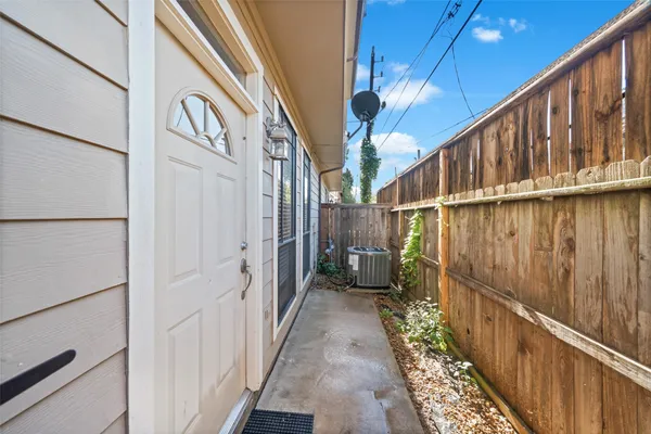 a view of a pathway of a house with wooden floor