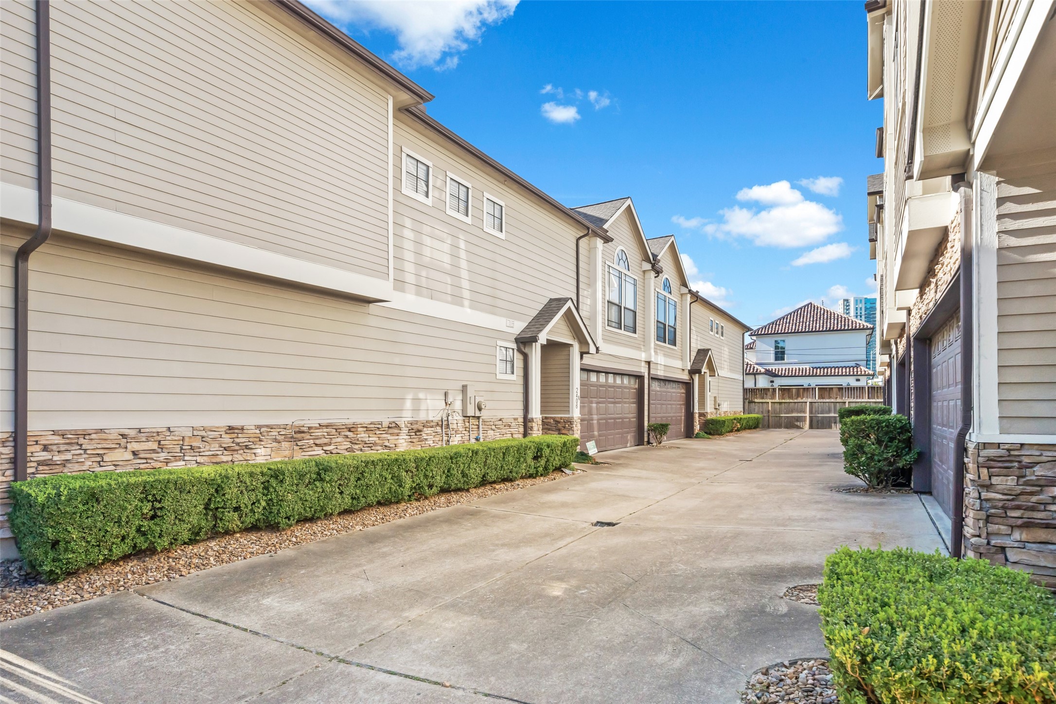 2406 Calumet Street Houston, TX 77004 - Photo 29 of 37 a view of a white house next to a yard with road