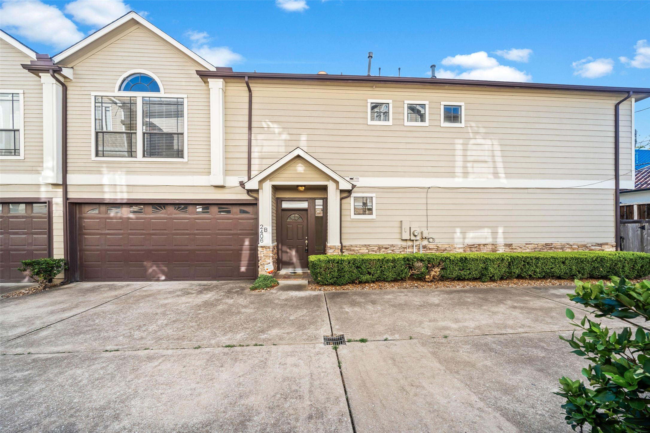 2406 Calumet Street Houston, TX 77004 - Photo 30 of 37 a front view of a house with a yard and garage