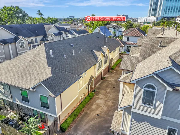 an aerial view of a house with a big yard