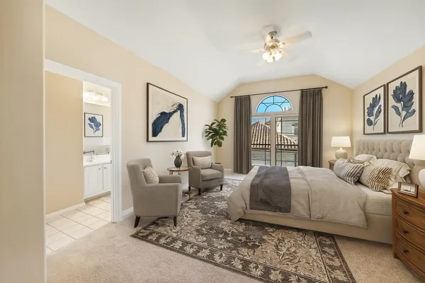 a living room with a bed furniture and a window