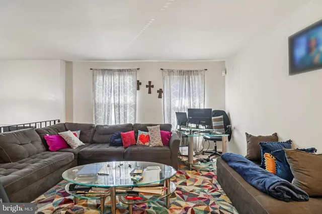 a living room with furniture and a couch