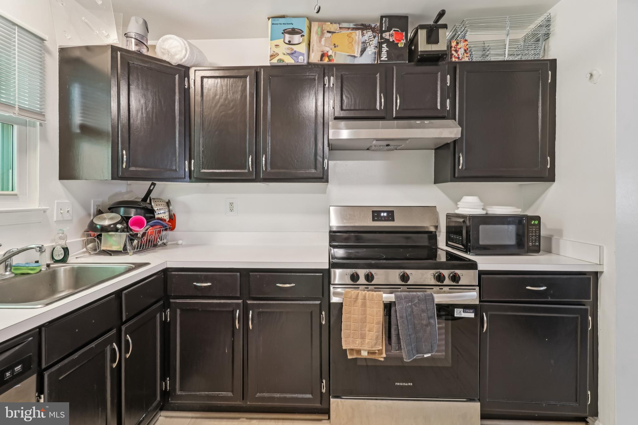 1000 Ute Way Capitol Heights, MD 20743 - Photo 16 of 51 a kitchen with stainless steel appliances granite countertop a sink stove and refrigerator