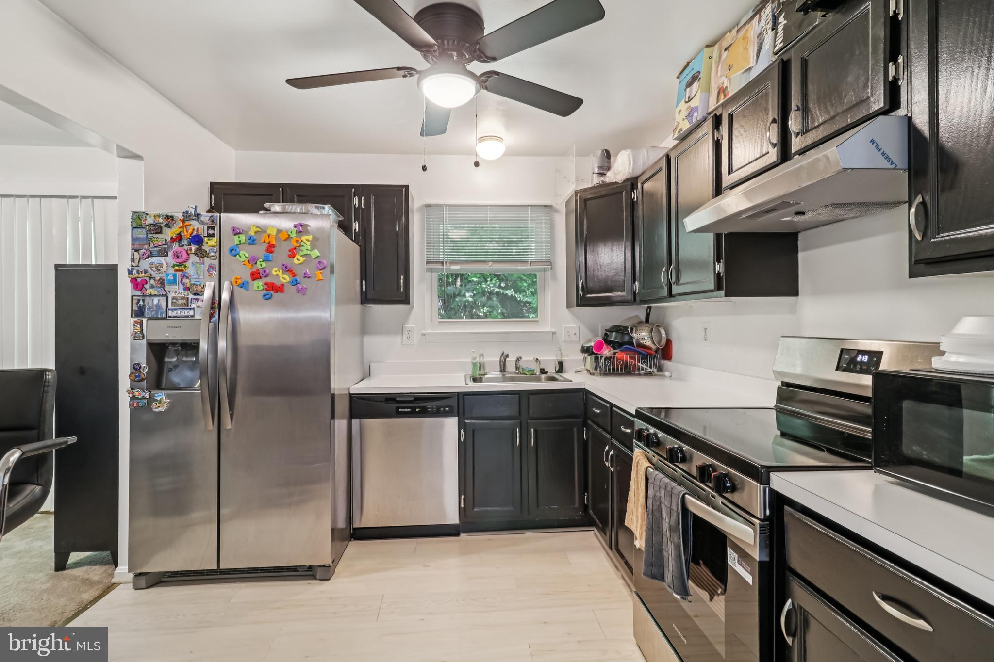 1000 Ute Way Capitol Heights, MD 20743 - Photo 17 of 51 a kitchen with stainless steel appliances granite countertop a refrigerator a sink a stove and cabinets