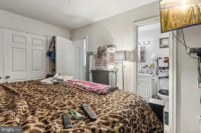 a bedroom with a bed and a cabinets