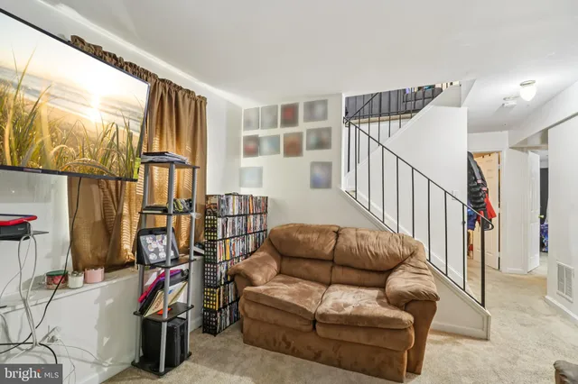 a livingroom with furniture entryway and a window