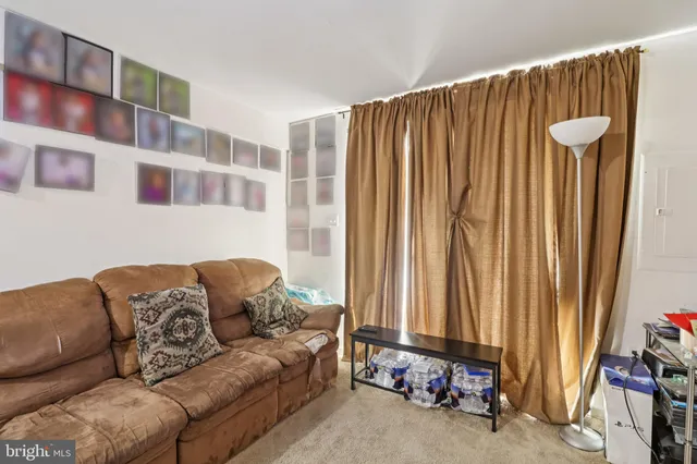 a living room with furniture and a garage