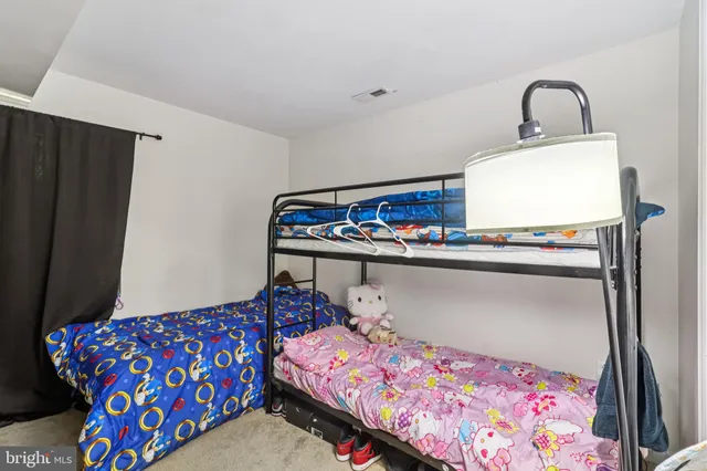 a bedroom with bed and a window