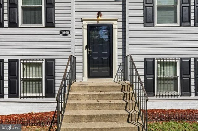 a view of a house with entrance and windows