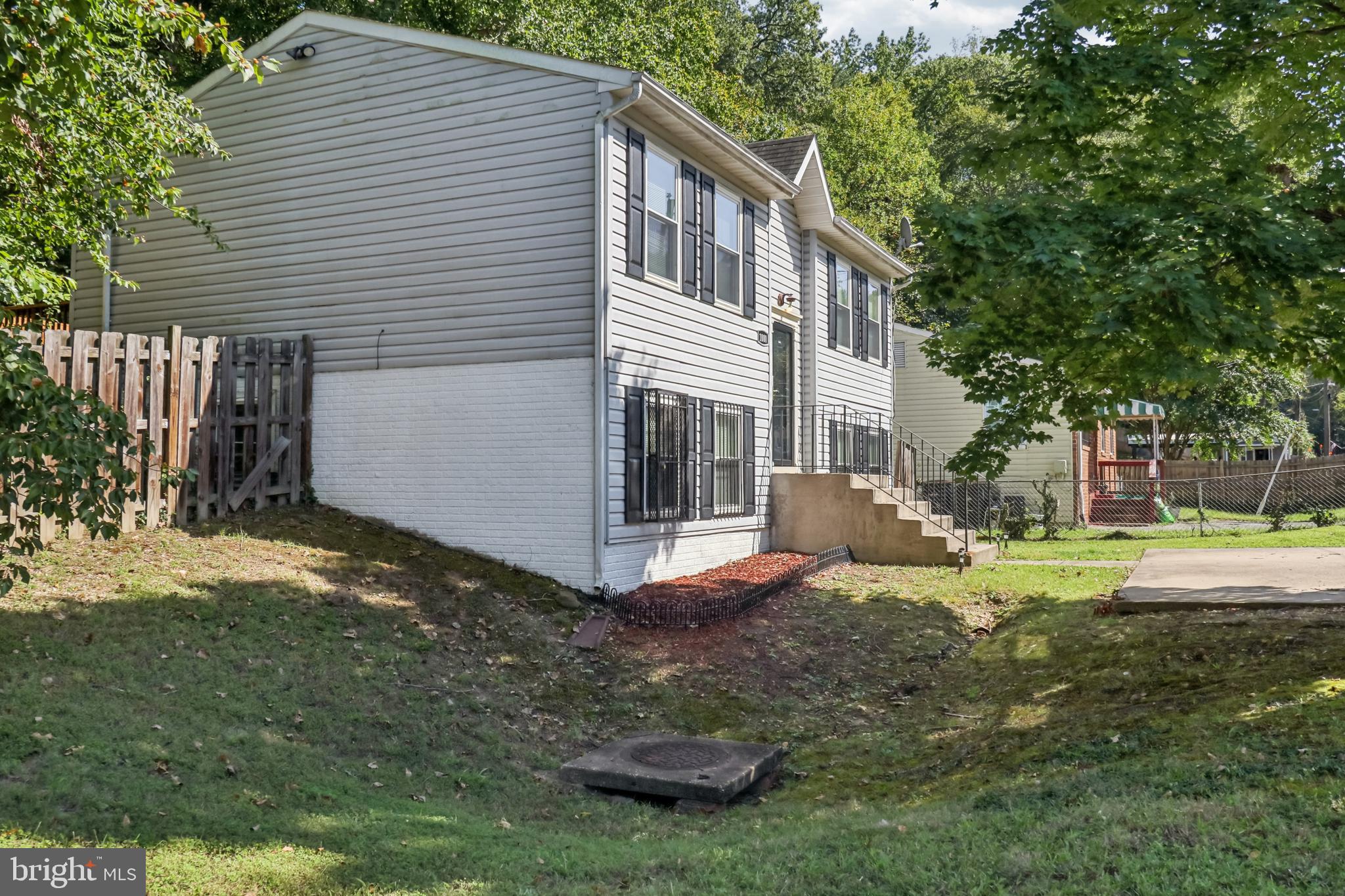 1000 Ute Way Capitol Heights, MD 20743 - Photo 8 of 51 a view of a house with backyard and trees
