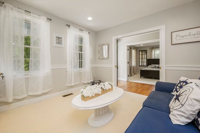 a living room with furniture and a table