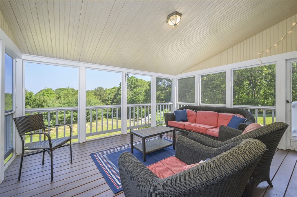 2 Daffodil Lane Barnstable, MA 02630 - Photo 20 of 42 a living room with furniture and a floor to ceiling window