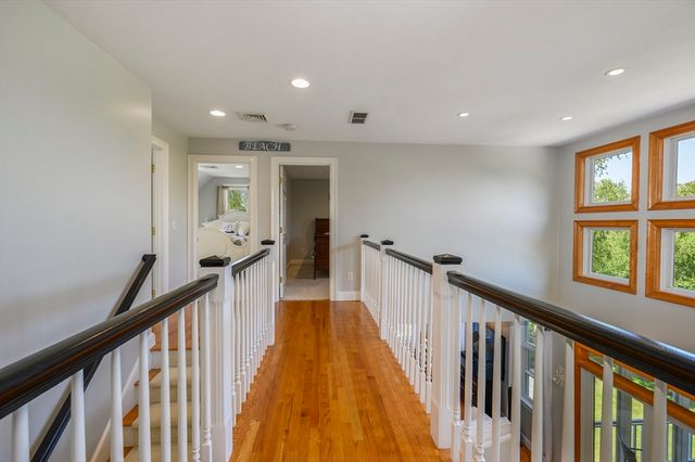 a view of a hallway with windows