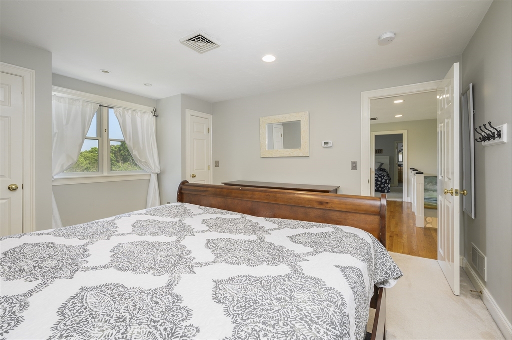 2 Daffodil Lane Barnstable, MA 02630 - Photo 27 of 42 a bedroom with a large bed and a window