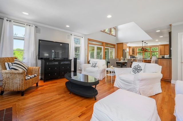 a living room with fireplace furniture and a flat screen tv