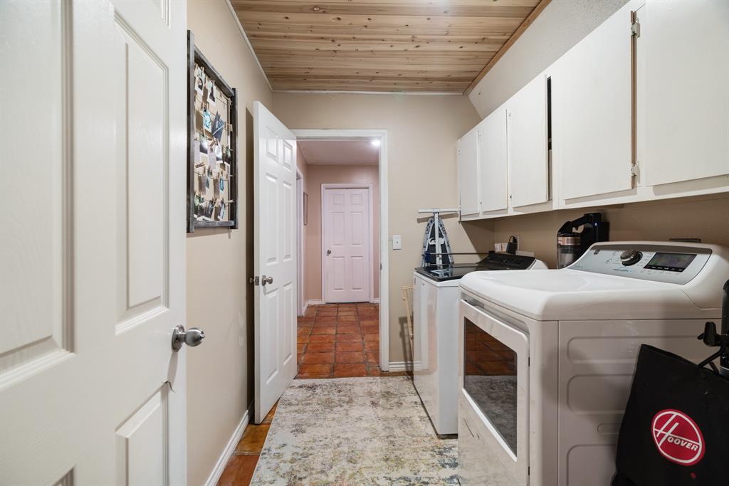 258 County Road Powderly, TX 75473 - Photo 11 of 24 a utility room with dryer and washer
