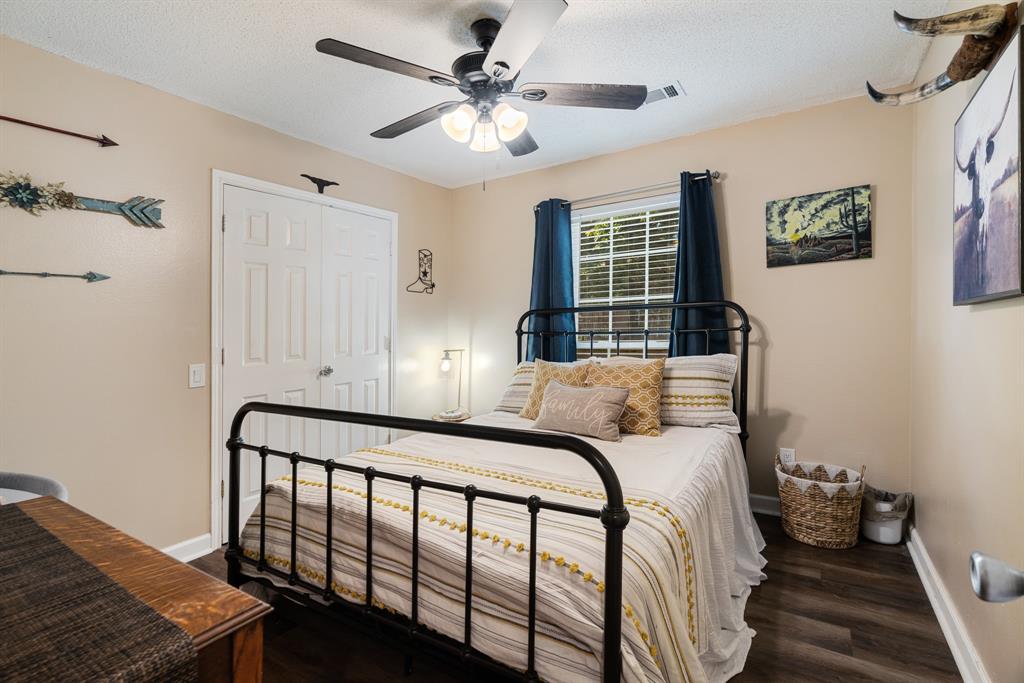 258 County Road Powderly, TX 75473 - Photo 17 of 24 a bedroom with a bed and a window