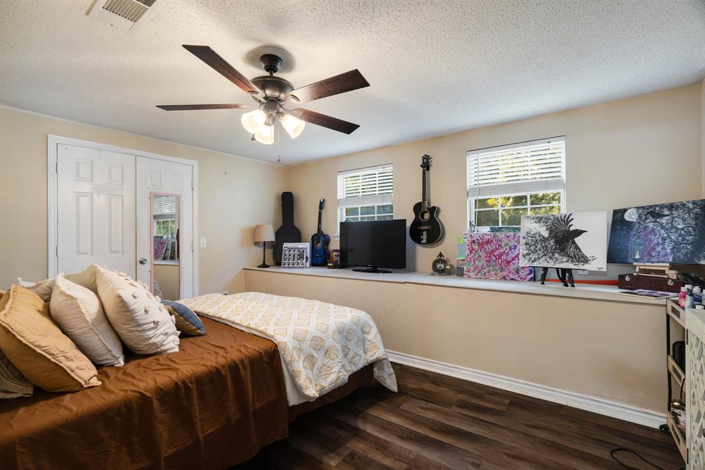 258 County Road Powderly, TX 75473 - Photo 20 of 24 a bed room with bed and window