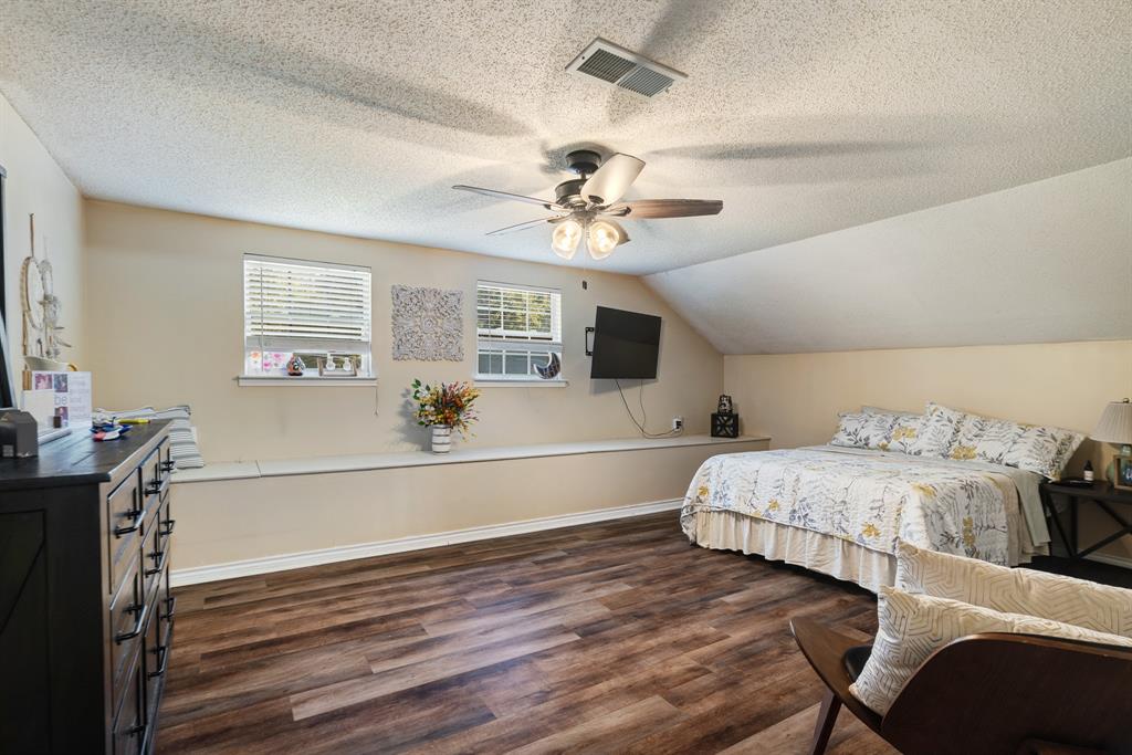 258 County Road Powderly, TX 75473 - Photo 21 of 24 a living room with a bed furniture a chandelier and a window