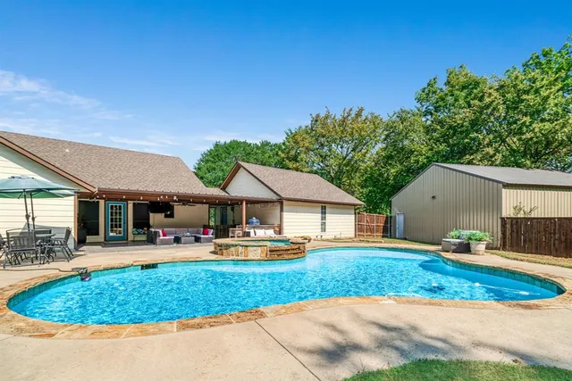 a front view of a house with swing and slide