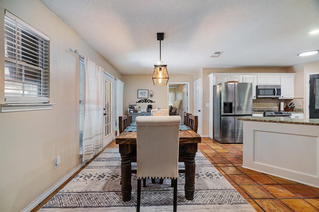 258 County Road Powderly, TX 75473 - Photo 5 of 24 a view of a dining room with furniture window and wooden floor