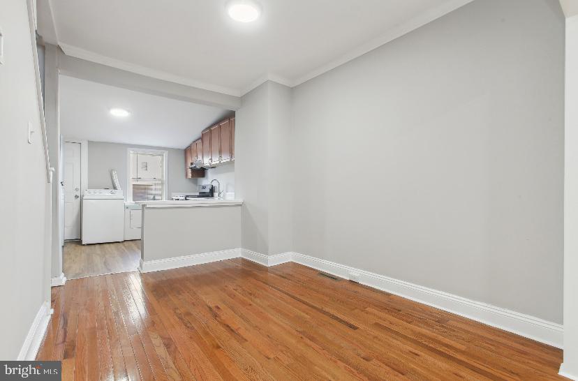 626 Archer Street Baltimore, MD 21230 - Photo 14 of 21 a view of kitchen with wooden floor