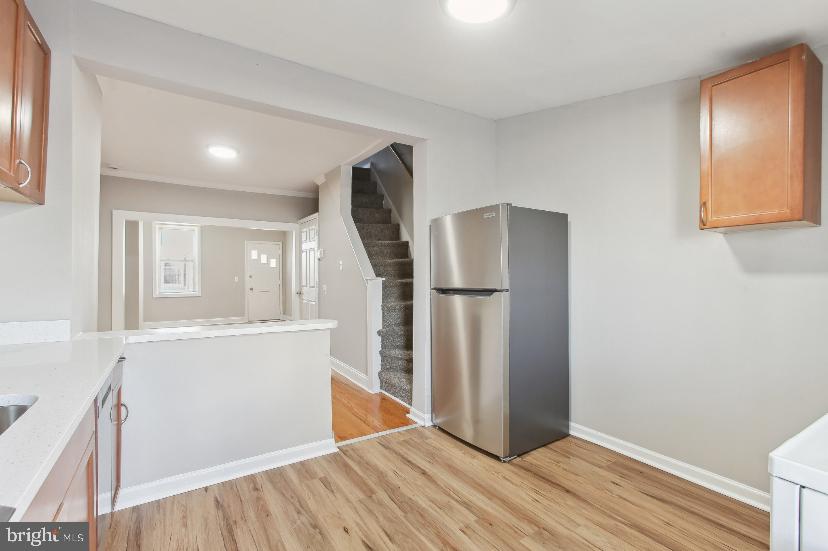 626 Archer Street Baltimore, MD 21230 - Photo 15 of 21 a view of a kitchen with wooden floor and electronic appliances