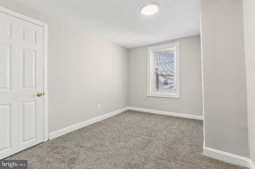 626 Archer Street Baltimore, MD 21230 - Photo 9 of 21 an empty room with windows