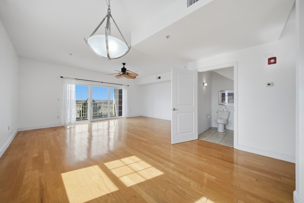 233 Beach Road, Unit A11 Salisbury, MA 01952 - Photo 9 of 37 a view of an empty room and window