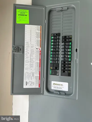 a kitchen with stainless steel appliances granite countertop a sink a stove and a wooden floors