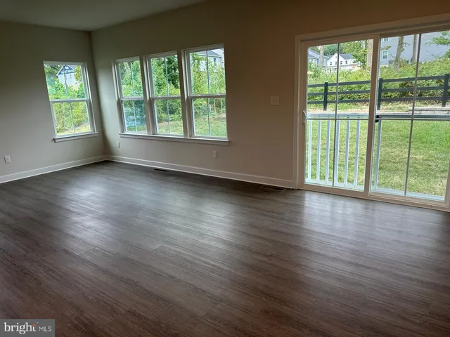 a kitchen with a stove a sink and a refrigerator