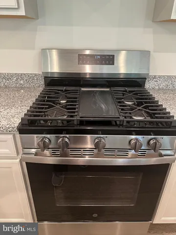 a kitchen with sink and window