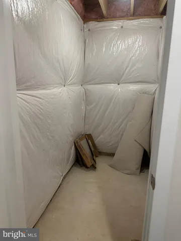 a view of a room with wooden walls