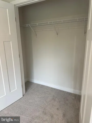 a view of an empty room with shelves