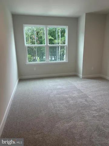 a bathroom with a double vanity sink mirror and toilet