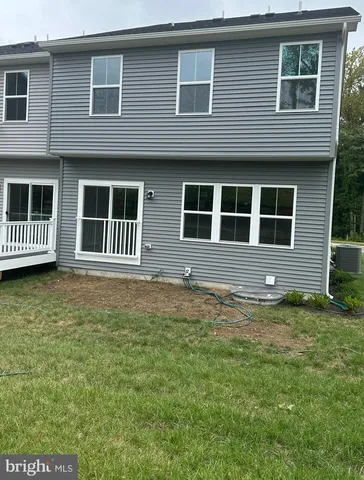 a house with garden in front of it