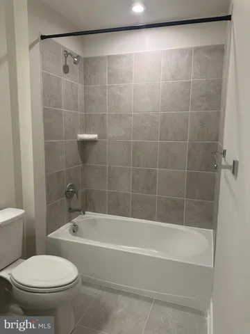 a spacious bathroom with a mirror sink and vanity