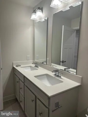 a bathroom with a shower and a sink