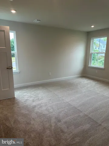 a white toilet sitting next to a sink