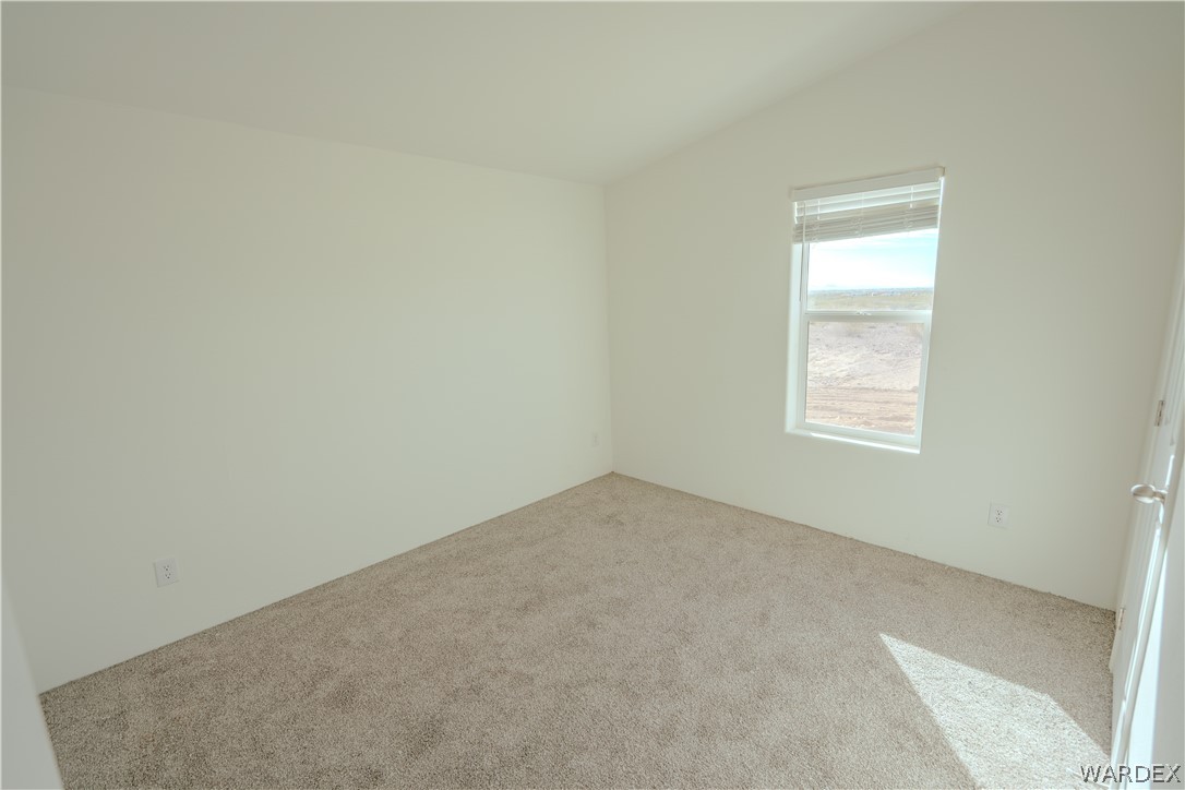5746 Eden Road Golden Valley, AZ 86413 - Photo 18 of 27 an empty room with a window