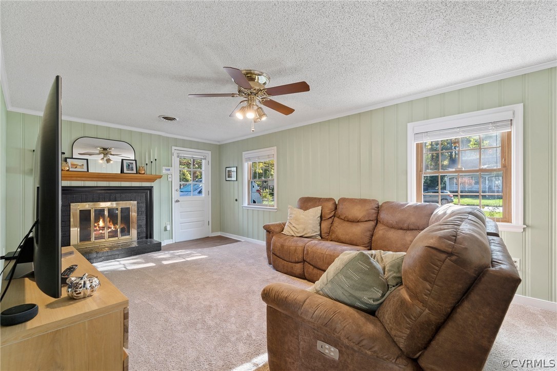 2304 Lashley Lane Henrico, VA 23238 - Photo 16 of 29 a living room with furniture a window and a fireplace