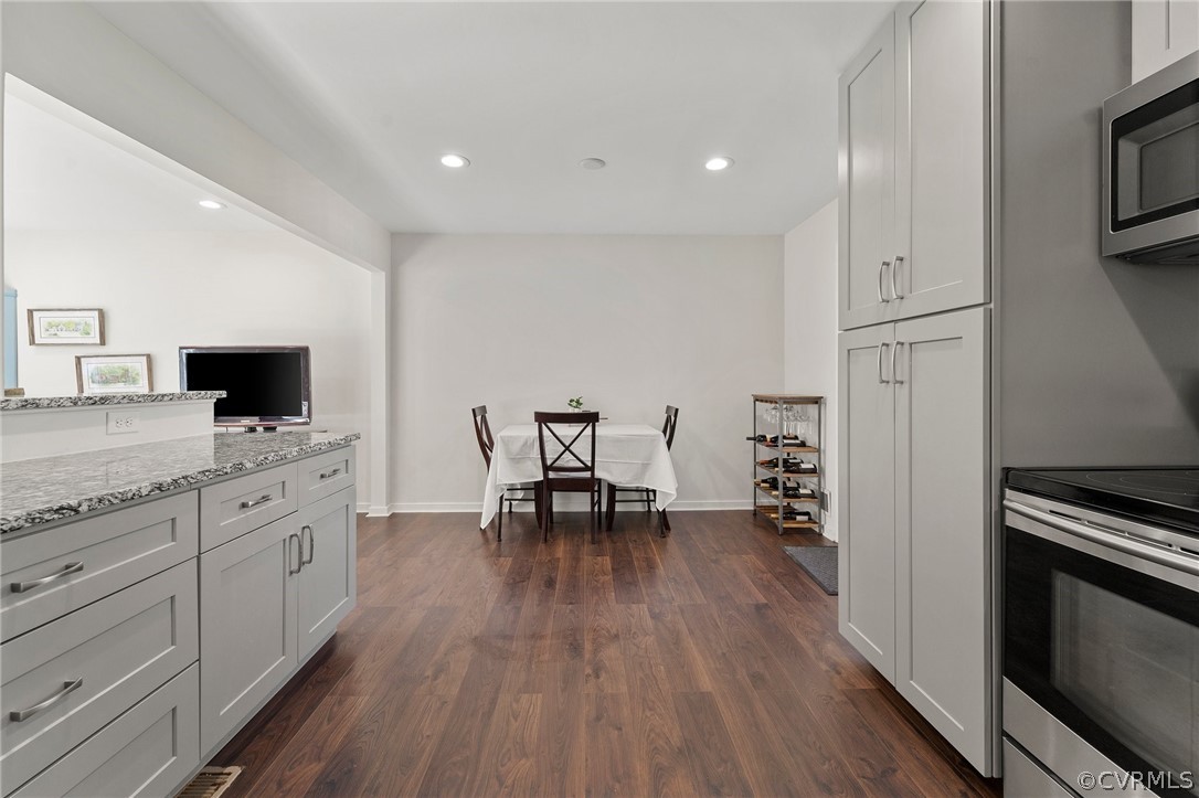2304 Lashley Lane Henrico, VA 23238 - Photo 8 of 29 a kitchen with granite countertop white cabinets and stainless steel appliances