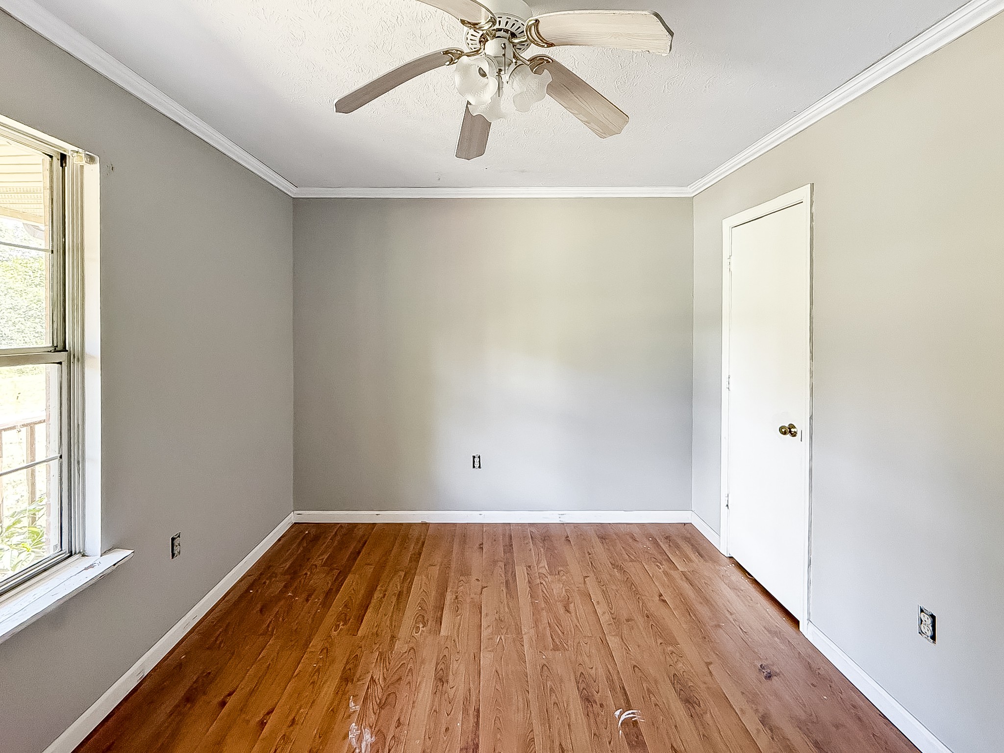 607 Cool Springs Road Morgantown, KY 42261 - Photo 14 of 18 wooden floor in an empty room with a window