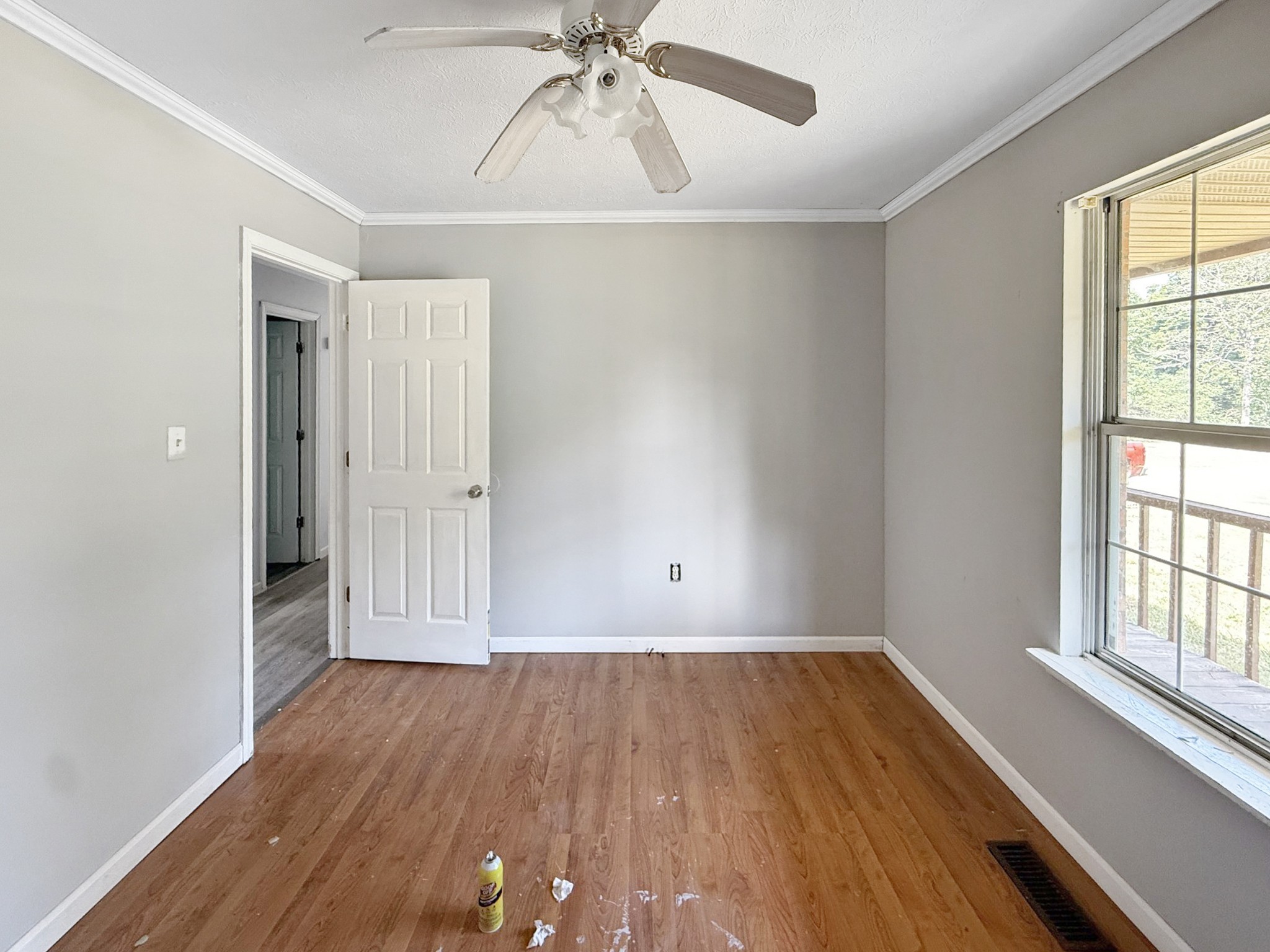 607 Cool Springs Road Morgantown, KY 42261 - Photo 15 of 18 wooden floor in an empty room with a window