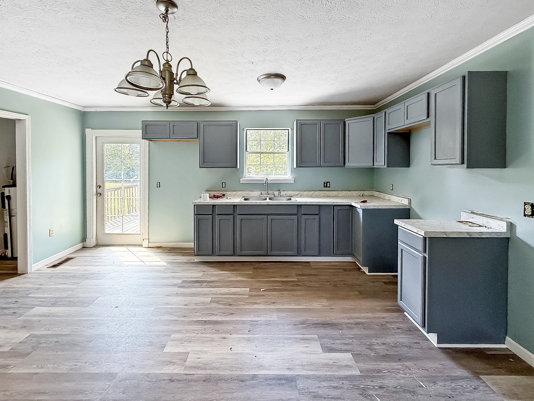 607 Cool Springs Road Morgantown, KY 42261 - Photo 5 of 18 a view of a kitchen with a sink and cabinets