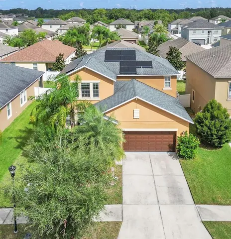 an aerial view of house with yard