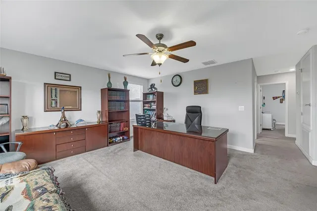 a bed room with furniture and a flat screen tv