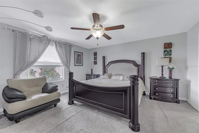 a bedroom with furniture and a window