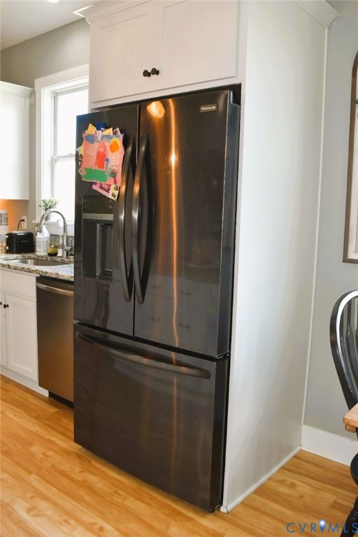 288 Moore Road Farmville, VA 23901 - Photo 21 of 33 a view of a refrigerator in kitchen and an empty room